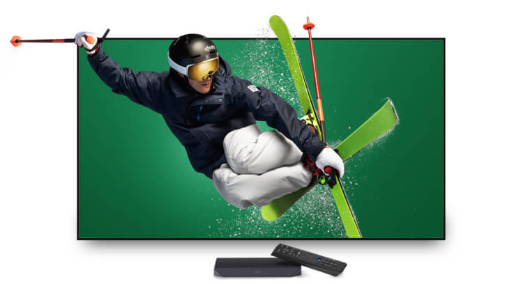 Alex Ferreira, U.S. Olympic Silver Medalist, Freestyle Skiing on television with X1 box and remote - mobile